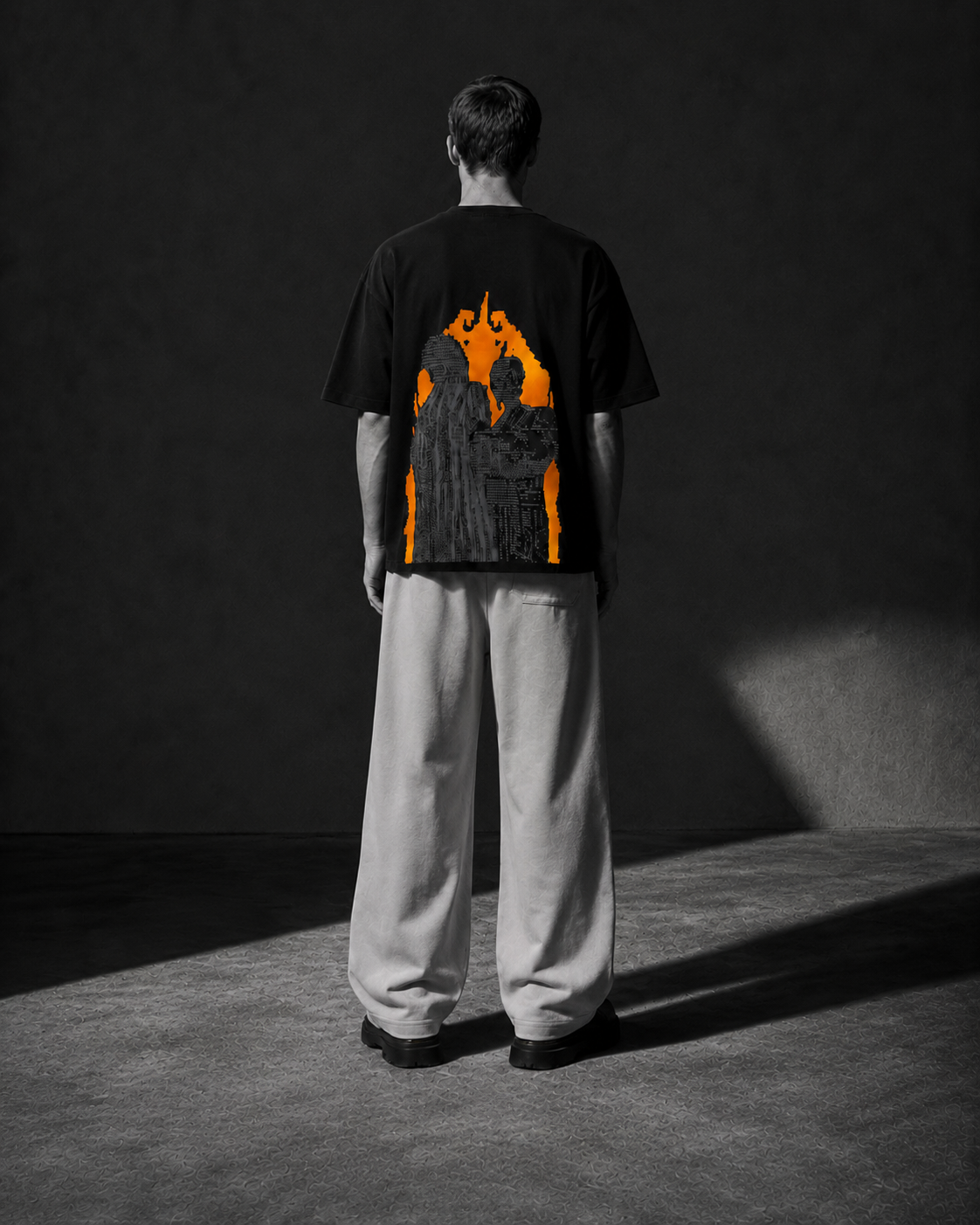 DECODEME black oversized T-shirt front fit in an underground concrete setting